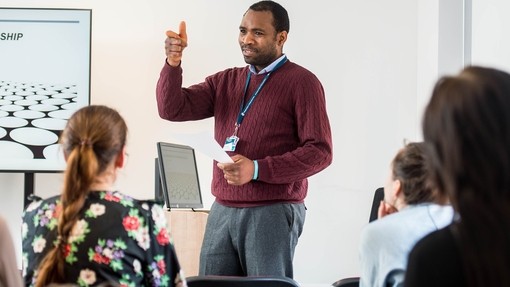 Staff member presenting to a class