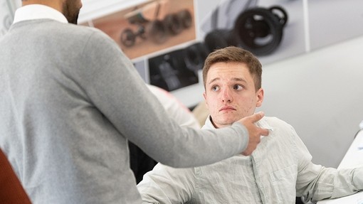 Lecturer in discussion with a student
