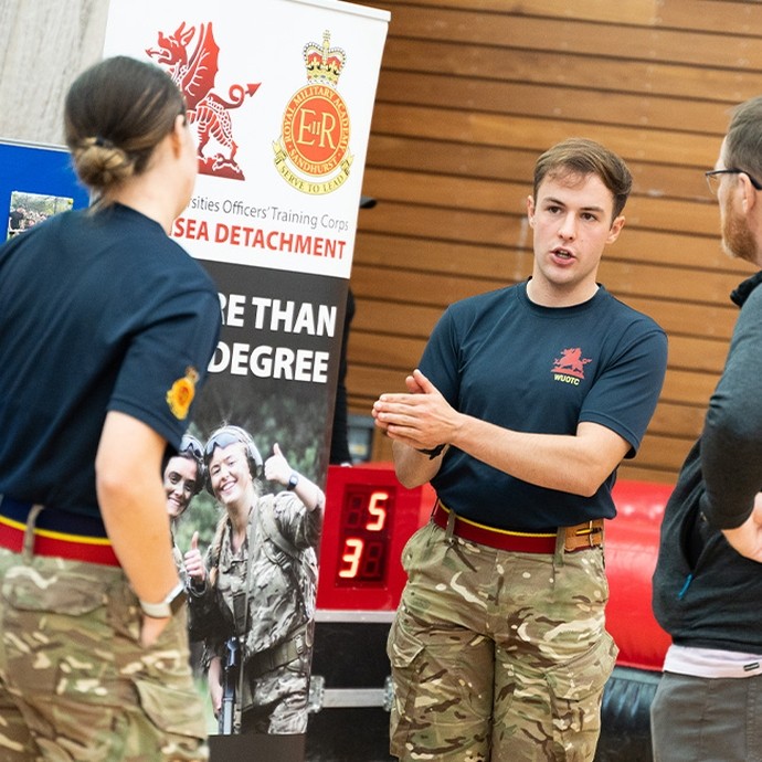 Armed forces representative at a recruitment fair