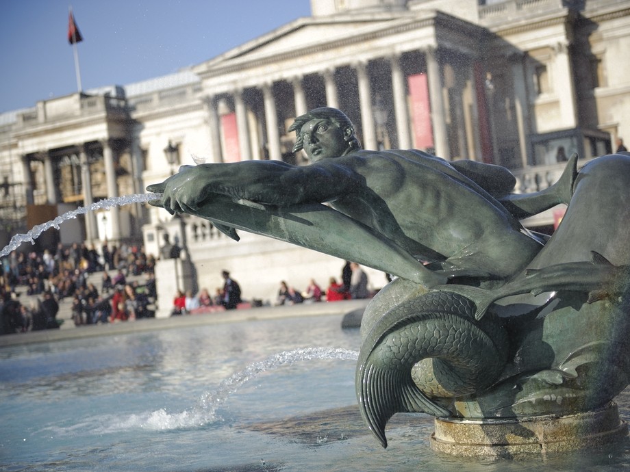 Student smiling and operating machinery 