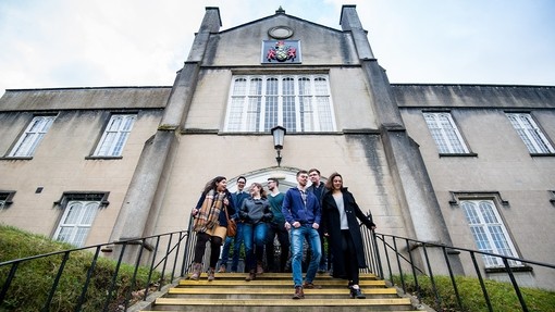 Students walking down the steps outside the Lampeter old building