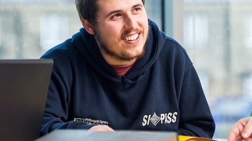 Student smiling and facing to the right