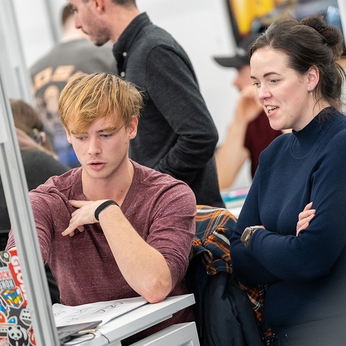 Student  in discussion with teacher